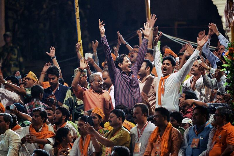 Supporters of Indian prime minister-elect Narendra Modi cheer after Modi and senior Bharatiya Janata Party leaders performed a religious ritual at the banks of the River Ganges in Varanasi, India. Roberto Schmidt / AFP