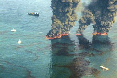 Controlled burns of oil spills carried out by the US Coast Guard after the Deepwater Horizon oil spill in the Gulf of Mexico. Serious environmental problems are often flagged up by a corporate culture that suggests a willingness to accept more minor infractions, says Pictet Asset Management's Frederic Salmon. AFP PHOTO 