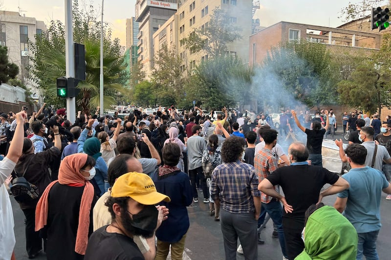 The crowd chanted 'Death to the dictator', meaning Supreme Leader Ayatollah Ali Khamenei, while some women took off their headscarves.  AFP