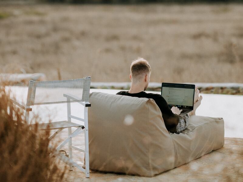 Dozens of countries offer digital nomad visas, including the UAE. Many Saudis are expected to work while on holiday next year, a poll found. Photo: Unsplash
