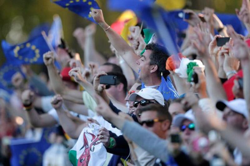 European fan celebrate their comeback win at the Ryder Cup PGA golf tournament Sunday, Sept. 30, 2012, at the Medinah Country Club in Medinah, Ill. (AP Photo/Charlie Riedel) 
