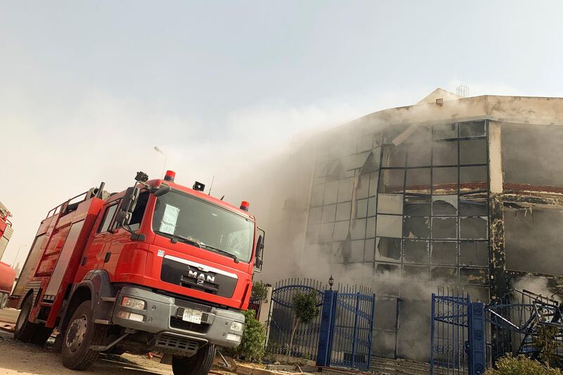 A firefighting truck is seen at the scene after a fire broke out in a garment factory north of Cairo, Egypt March 11, 2021. REUTERS/Amr Abdallah Dalah