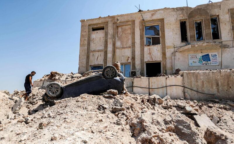 A view outside a health facility that was hit by a reported Russian air strike after midnight in town of Urum al-Kubra in the western countryside of Syria's northern Aleppo province, just before a truce went into effect.    AFP