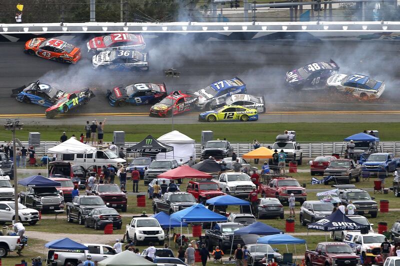 The first crash of the race after just 14 laps. AFP