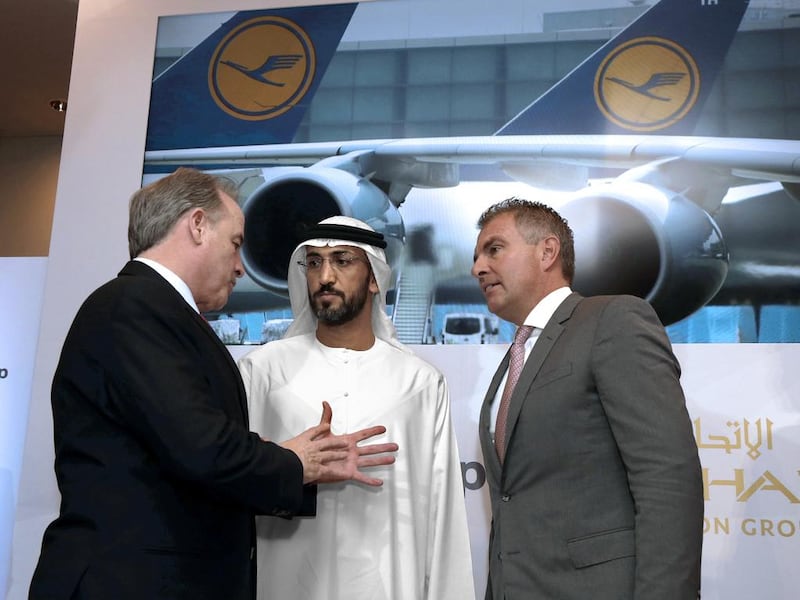 From left, James Hogan, the chief executive of Etihad Aviation Group, Mohamed Al Mazrouei, the Etihad chairman and Lufthansa’s Carsten Spohr. Jeffrey E Biteng / The National 