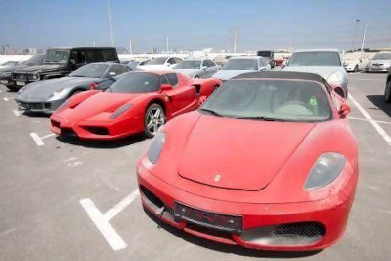 Luxury cars await buyers at the confiscated vehicle compound in Al Qusais.