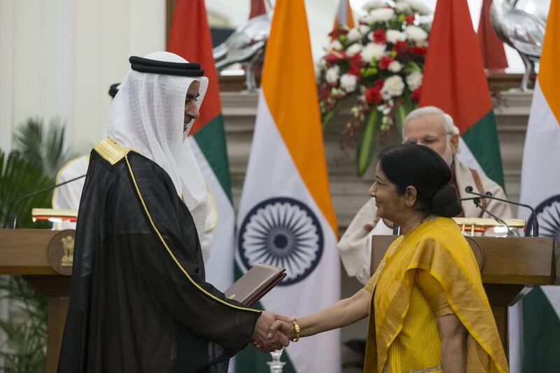 Sheikh Mohammed bin Zayed, Crown Prince of Abu Dhabi and Deputy Supreme Commander of the  Armed Forces (hidden) and Narendra Modi Prime Minister of India witness the exchange of a memorandum of understanding between India and the UAE cooperation between the UAE Interior Ministry and India’s Home Affairs Ministry. Seen exchanging on behalf of the UAE is Lt Gen Sheikh Saif bin Zayed, Deputy Prime Minister and Minister of Interior. Ryan Carter / Crown Prince Court - Abu Dhabi