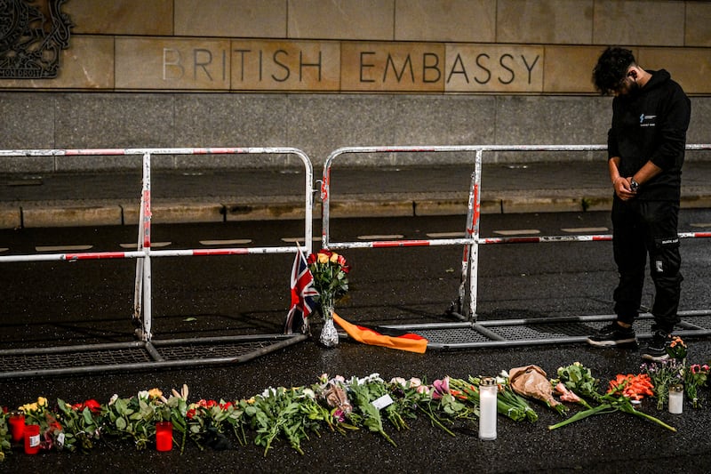 A man pays his respects in front of the British Embassy in Berlin, Germany. EPA