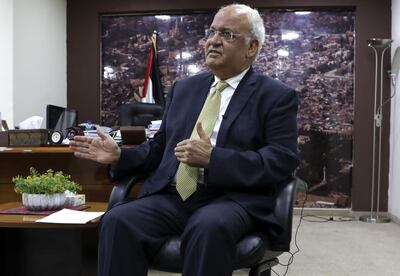 Saeb Erekat, Secretary-General of the Palestine Liberation Organisation and chief Palestinian negotiator, talks to reporters about the recent Israeli elections in the West Bank city of Ramallah on March 3, 2020. Prime Minister Benjamin Netanyahu claimed victory in Israel's general election, with exit polls putting the indicted premier in a strong position to form the next government.The previous day Erekat said the exit polls by Israeli media showed that "settlement, annexation and apartheid have won the Israeli elections."
 / AFP / ABBAS MOMANI
