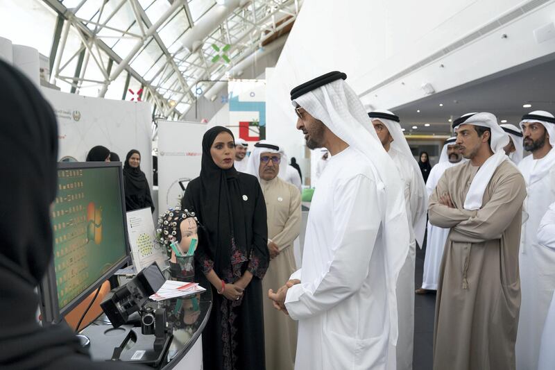 AL AIN, ABU DHABI, UNITED ARAB EMIRATES - February 7, 2019: HH Sheikh Mohamed bin Zayed Al Nahyan, Crown Prince of Abu Dhabi and Deputy Supreme Commander of the UAE Armed Forces (C), speaks with students while visiting UAE University in Al Ain. Seen with HH Sheikh Mansour bin Zayed Al Nahyan, UAE Deputy Prime Minister and Minister of Presidential Affairs (back 2nd R), and HE Mohamed Mubarak Al Mazrouei, Undersecretary of the Crown Prince Court of Abu Dhabi (back R). 
( Ryan Carter / Ministry of Presidential Affairs )
---