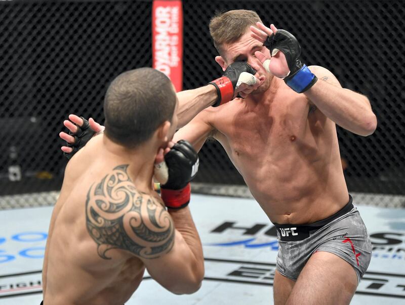 ABU DHABI, UNITED ARAB EMIRATES - JULY 26: (L-R) Robert Whittaker of New Zealand punches Darren Till of England in their middleweight fight during the UFC Fight Night event inside Flash Forum on UFC Fight Island on July 26, 2020 in Yas Island, Abu Dhabi, United Arab Emirates. (Photo by Jeff Bottari/Zuffa LLC via Getty Images)