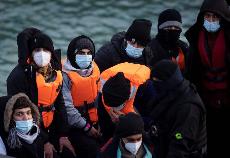 Migrants onboard a UK Border Force vessel  are brought into port of Dover, in southern England. AFP