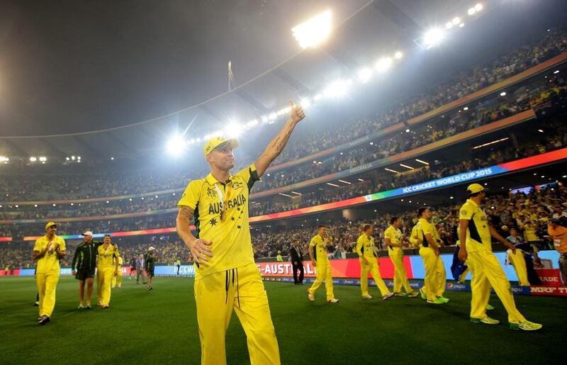 Clarke gestures to the crowd as he celebrates the seven wicket victory over New Zealand. Rob Griffith / AP Photo