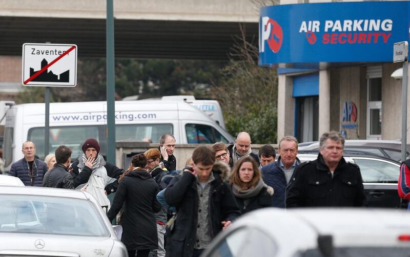 People leave the airport area after explosions at Brussels Airport in Zaventem, near Brussels, Belgium. Dozens of people have died or been injured in a double blast in the departure hall of Zaventem Airport in Brussels, Belgian media reported. Laurent Dubrule / EPA