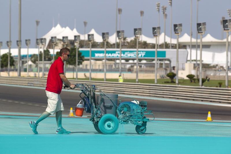 Contractors lay a total of 8,550 litres of water-based paint. The team will apply 4,500 litres of ‘Yas blue’ paint, 720 litres of ivory, 1,440 litres of red and 1,440 litres of white paint to the track ahead of the Abu Dhabi Grand Prix. Courtesy Seven Media