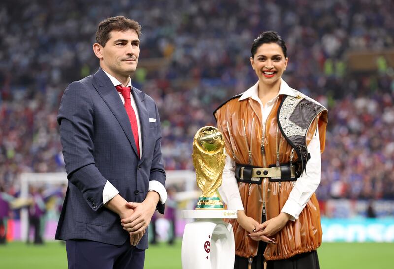 Iker Casillas and Deepika Padukone present the Fifa World Cup trophy at the Lusail Stadium. Getty