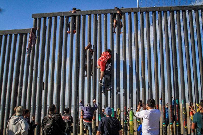 Migrants attempt to enter the United States illegally from the Playas Tijuana area in the Mexican state of Baja. EPA