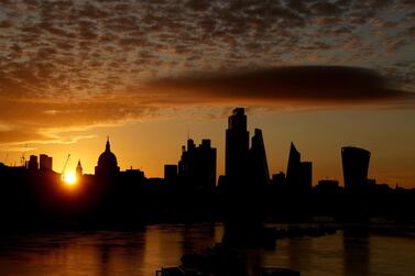 The sun rises behind the skyline of the City of London, Britain. Mr Sunak has already made it clear that the tech sector is a key focus of the budget next week. Reuters
