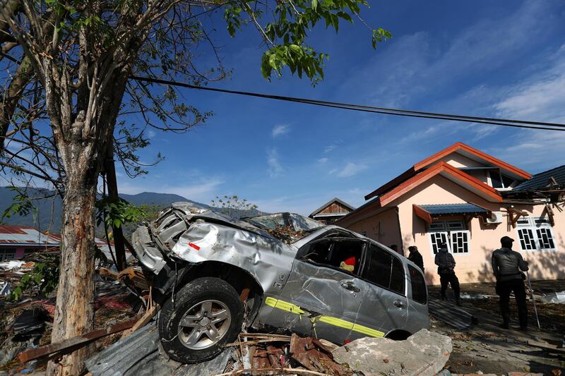 Rescuers officers search an area in Palu, where more than 1,000 people are unaccounted for. Reuters