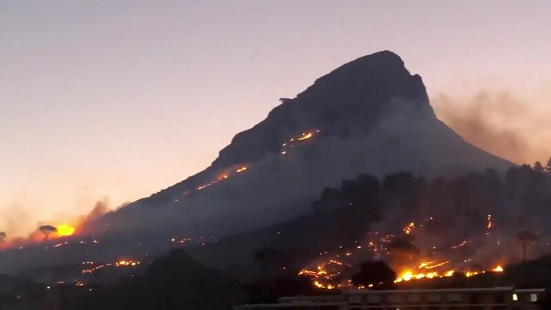 Smoke rises from a burning mountainside in Cape Town, South Africa. Chantal Louw / via Reuters