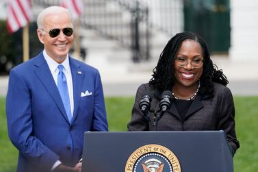 FILE - President Joe Biden listens as Judge Ketanji Brown Jackson speaks during an event on the South Lawn of the White House in Washington, April 8, 2022, celebrating the confirmation of Jackson as the first Black woman to reach the Supreme Court.  The first Black woman confirmed for the Supreme Court, Jackson, is officially becoming a justice.  Jackson will be sworn as the court’s 116th justice at midday Thursday, June 30, just as the man she is replacing, Justice Stephen Breyer, retires.  (AP Photo / Andrew Harnik, File)