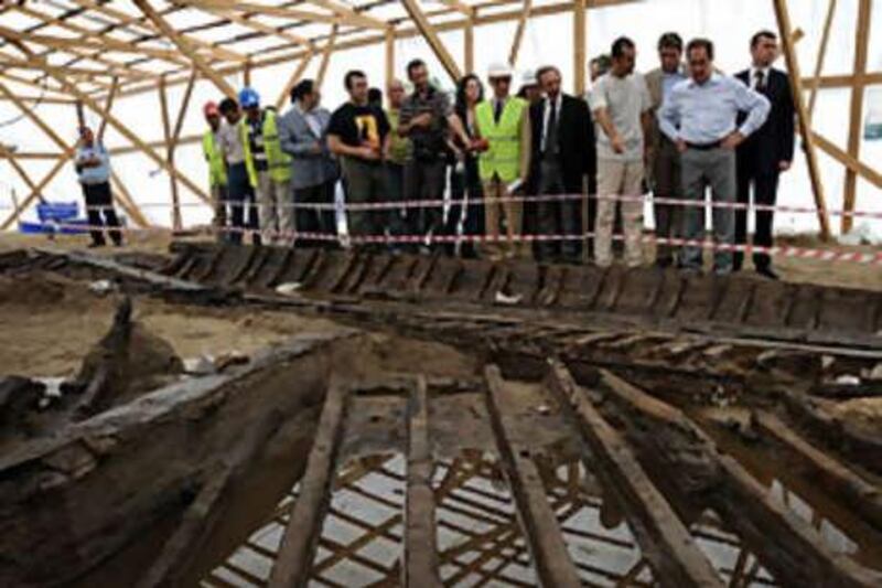 The Turkish minister of culture and tourism, Ertugrul Gunay, examines the excavation work and archaeological finds at the site of the Marmaray project in Yenikapi, Istanbul.