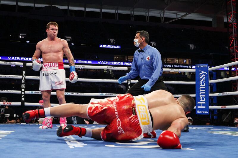Saul Alvarez kncoks down Avni Yildirim on his way to victory in their WBA, WBC and Ring Magazine super middleweight championship bout at the Hard Rock Stadium in Miami Gardens, Florida, on Saturday, February 27