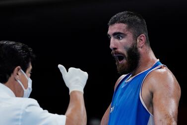 France's Mourad Aliev reacts after losing by disqualification against Britain's Frazer Clarke during their men's super heavy (over 91kg) quarter-final boxing match during the Tokyo 2020 Olympic Games at the Kokugikan Arena in Tokyo on August 1, 2021.  (Photo by THEMBA HADEBE  /  POOL  /  AFP)