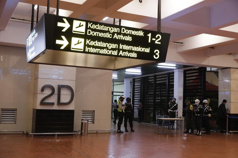 Officials are seen at Soekarno-Hatta International Airport. EPA