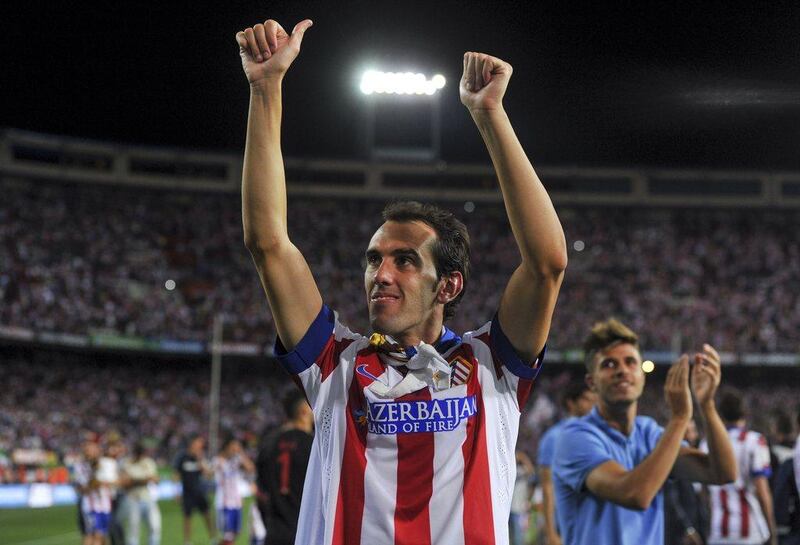 Atletico Madrid defender Diego Godin celebrates their victory for the Spanish Super Cup on Friday over Real Madrid. Dani Pozo / AFP
