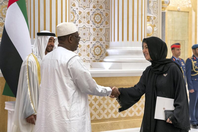 ABU DHABI, UNITED ARAB EMIRATES - February 06, 2020: HE Reem Ibrahim Al Hashimi, UAE Minister of State for International Cooperation (R) greets HE Macky Sall, President of Senegal (C), during an official visit reception at Qasr Al Watan. Seen with HH Sheikh Mohamed bin Zayed Al Nahyan, Crown Prince of Abu Dhabi and Deputy Supreme Commander of the UAE Armed Forces (L).

( Mohamed Al Hammadi / Ministry of Presidential Affairs )
---