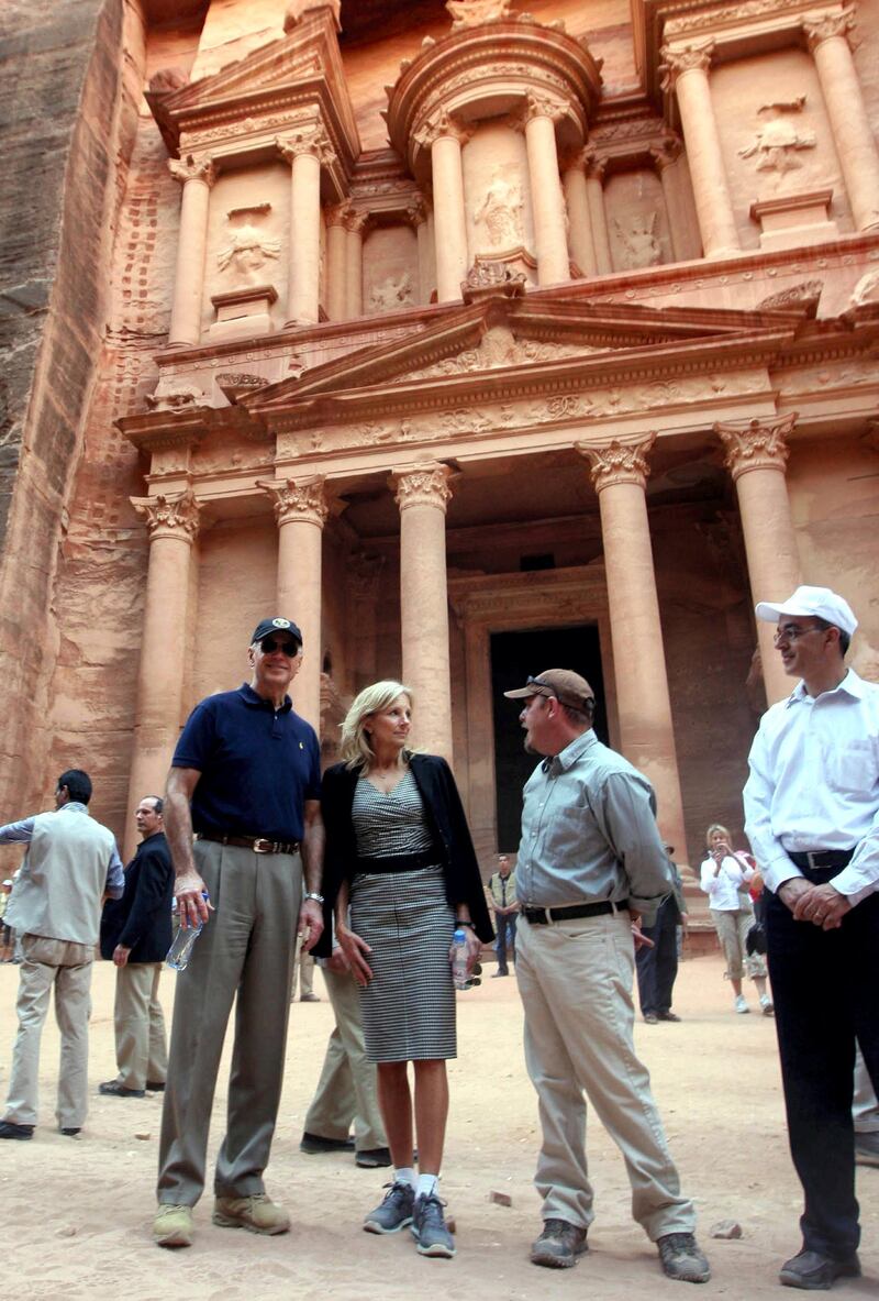 US Vice President Joseph Biden (L) and his wife Dr Jill Biden (C) tour the Nabatean city of Petra in southern Jordan on March 12, 2010. Biden's visit to Petra came at the end of a regional trip that saw him meeting with Israeli and Palestinian leaders and Jordan's King Abdullah II. AFP PHOTO/KHALIL MAZRAAWI (Photo by KHALIL MAZRAAWI / AFP)