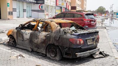 Ten cars were damaged as a result of the building fire. Photo: Ajman Police