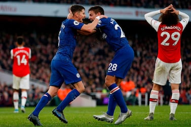 TOPSHOT - Chelsea's Italian midfielder Jorginho (L) celebrates scoring their first goal to equalise 1-1 with Chelsea's Spanish defender Cesar Azpilicueta (R) during the English Premier League football match between Arsenal and Chelsea at the Emirates Stadium in London on December 29, 2019. - RESTRICTED TO EDITORIAL USE. No use with unauthorized audio, video, data, fixture lists, club/league logos or 'live' services. Online in-match use limited to 45 images, no video emulation. No use in betting, games or single club/league/player publications. / AFP / IKIMAGES / Ian KINGTON / RESTRICTED TO EDITORIAL USE. No use with unauthorized audio, video, data, fixture lists, club/league logos or 'live' services. Online in-match use limited to 45 images, no video emulation. No use in betting, games or single club/league/player publications.