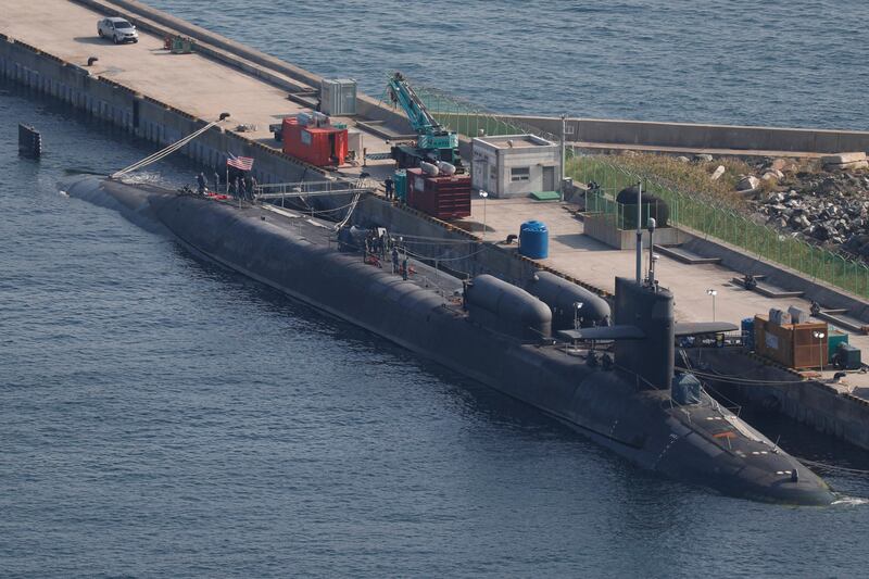 epa06262650 The USS Michigan (SSGN 727), the second Ohio-class nuclear-powered guided missile submarine in the US Navy, is docked at naval base in Busan, South Korea, 13 October 2017. The 18,000-ton submarine has a length of 170.6 meters and carries 150 Tomahawk cruise missiles and arrived in South Korea on 13 October amid North Korea's nuclear and missile provocations.  EPA/JEON HEON-KYUN