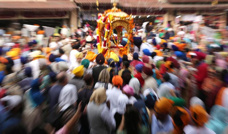 Sikh devotees carrying the Sri Guru Granth Sahib ji, the holy book of Sikh religion, during a procession in Amritsar, India.  EPA
