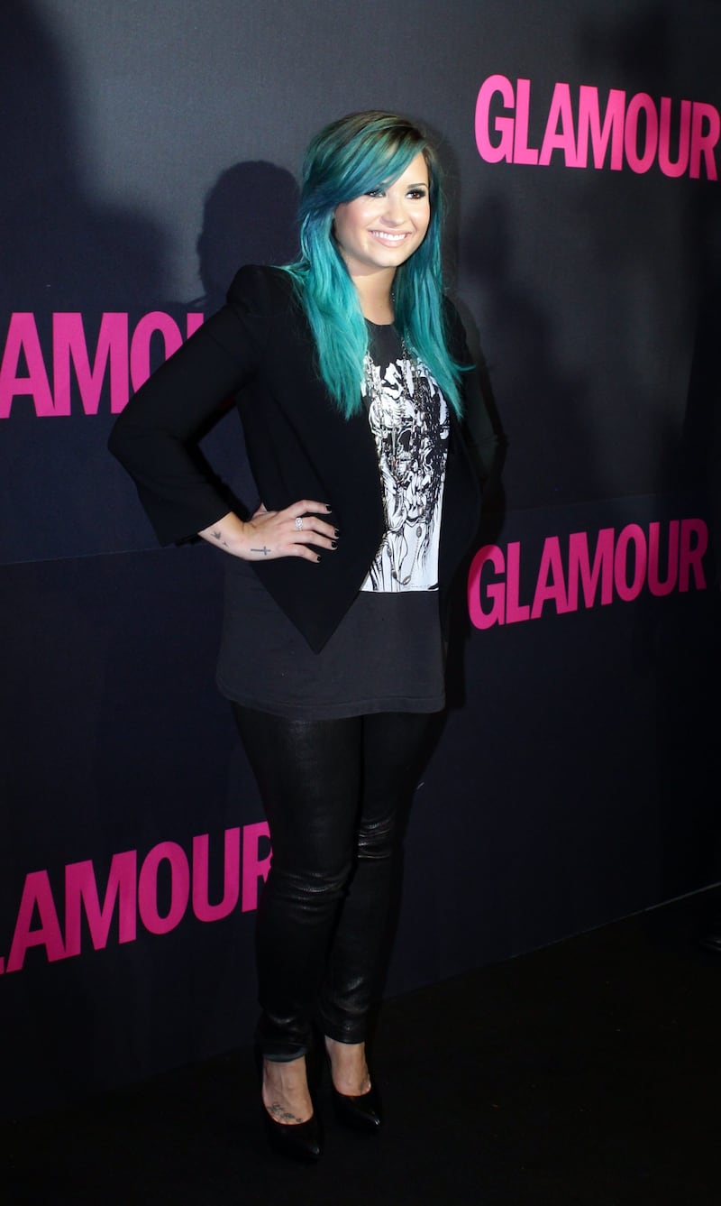 epa03905229 US singer Demi Lovato poses upon arrival at the 15th anniversary of magazine Glamour in Mexico City, Mexico, 10 October 2013.  EPA/JOSE MENDEZ