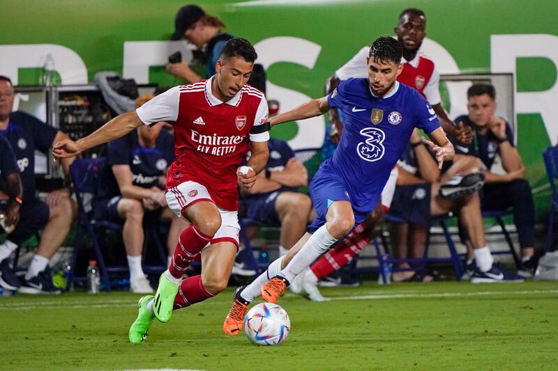 Arsenal forward Gabriel Martinelli moves the ball past Chelsea midfielder Jorginho. AP