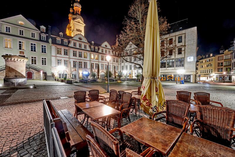 The otherwise busy Am Plan market square in Koblenz's old town is deserted in Koblenz, Germany. Due to the coronavirus pandemic, there is a general curfew in Koblenz in the evenings from 10 p.m. AP