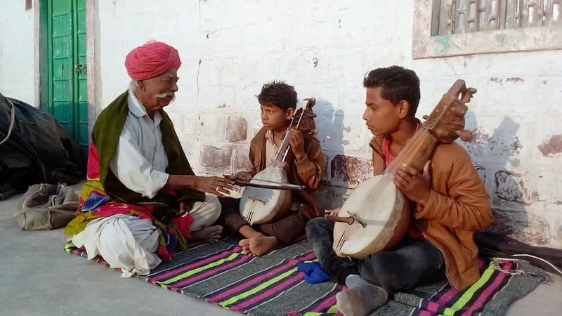 Hakam Khan with his students. courtesy: Manjoor Khan