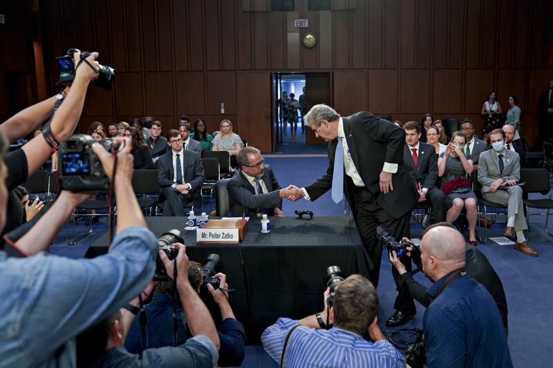 John Kennedy, a Republican from Louisiana, shakes hands with Mr Zatko at the hearing. Bloomberg 