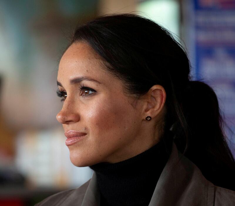 FILE PHOTO: Prince Harry, The Duke of Sussex with Meghan Markle the Duchess of Sussex meet young people from a number of mental health projects operating in New Zealand, at the Maranui Cafe in Wellington, New Zealand October 29, 2018. Ian Vogler/Pool via REUTERS/File Photo