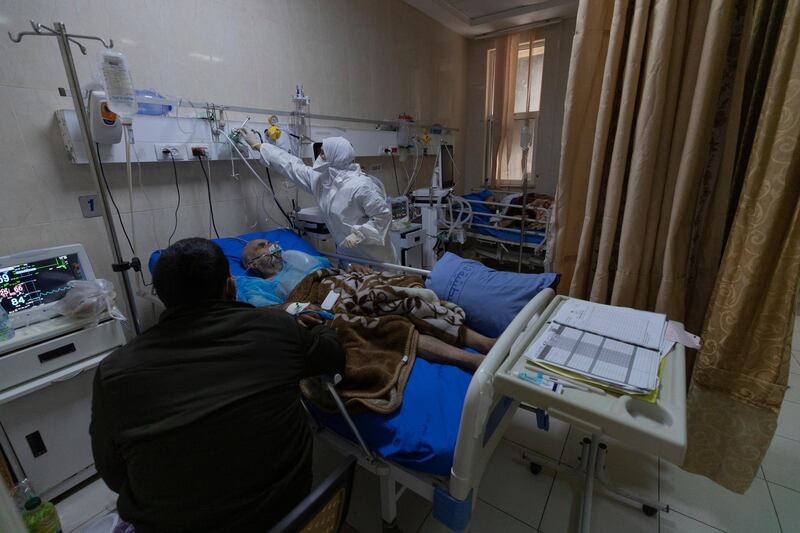 A medical staffer attends a Palestinian Covid-19 patient at the intensive care unit, in the Palestine Medical Complex, in the West Bank city of Ramallah. AP