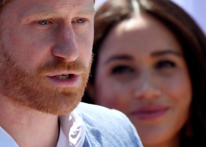 Britain's Prince Harry, Duke of Sussex, gives a speech as his wife Meghan, Duchess of Sussex, looks on, during a visit to the Youth Employment Services (YES) Hub in Tembisa township, near Johannesburg, South Africa. Reuters