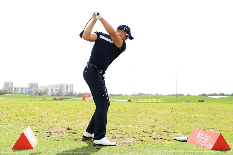 Henrik Stenson of Sweden practices on the range. Andrew Redington/Getty Images