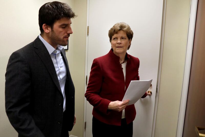 FILE PHOTO: U.S. Senator Jean Shaheen (D-NH) walks with her aid on Capitol Hill in Washington, U.S., December 21, 2017. Picture taken December 21, 2017.  REUTERS/Yuri Gripas/File Photo