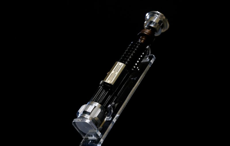 Obi-Wan Kenobi's Hero Lightsaber from 'Star Wars: Revenge of the Sith' is seen at a preview of a movie and TV memorabilia auction in Rickmansworth, Britain on October 15, 2020. Reuters