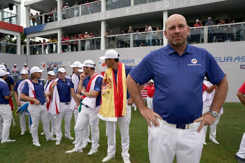 KUALA LUMPUR, MALAYSIA - JANUARY 14:  Europe Captain Thomas Bjorn and the Europe team prepares to enter the presentation ceremony following their victory during the singles matches on day three of the 2018 EurAsia Cup presented by DRB-HICOMat Glenmarie G&CC on January 14, 2018 in Kuala Lumpur, Malaysia.  (Photo by Stanley Chou/Getty Images)