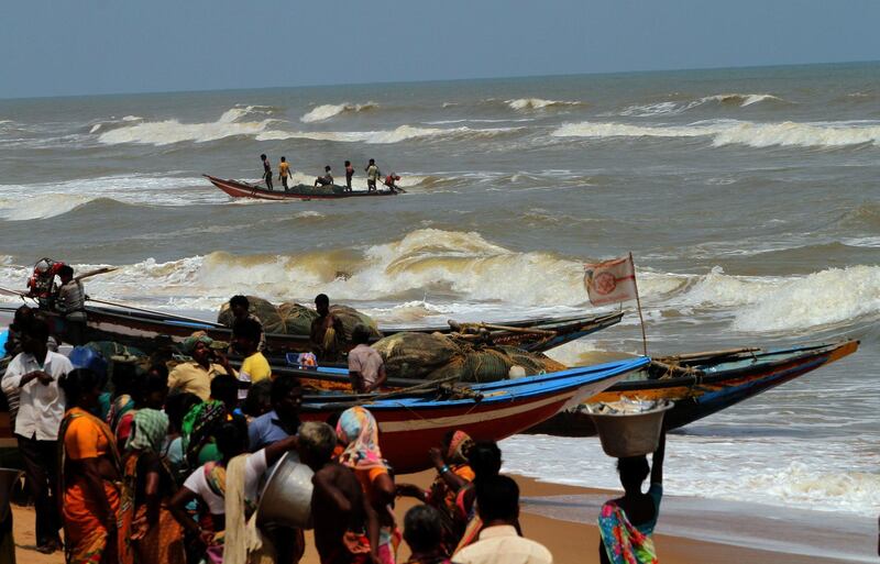 Fishermen land at a beach in the Bay of Bengal after the Cyclone Fani alert in Orissa, India. EPA