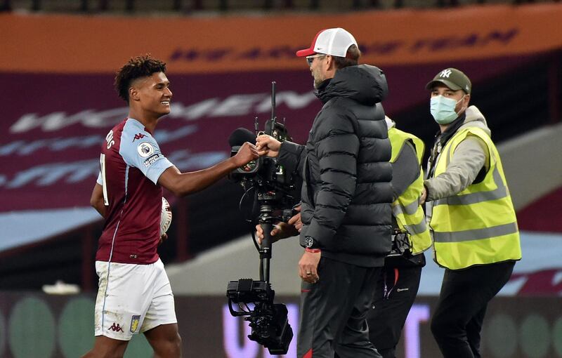 Liverpool manager Jurgen Klopp fist bumps Aston Villa's Ollie Watkins after the match at Villa Park. PA